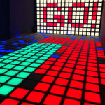 Vibrant MetaNexusXR LED dance floor grid tiles activated for interactive touch games. | MetaNexusXR