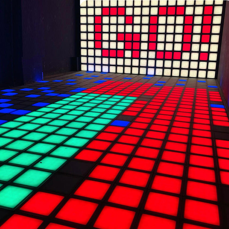 Vibrant MetaNexusXR LED dance floor grid tiles activated for interactive touch games. | MetaNexusXR